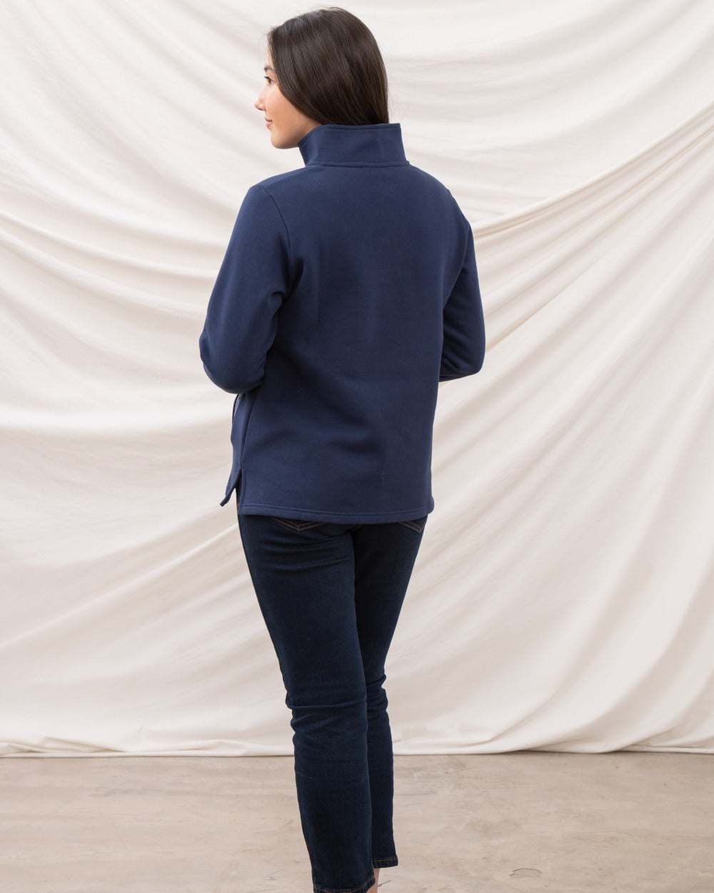 Navy coloured Lighthouse Shore Jersey Top on curtain background