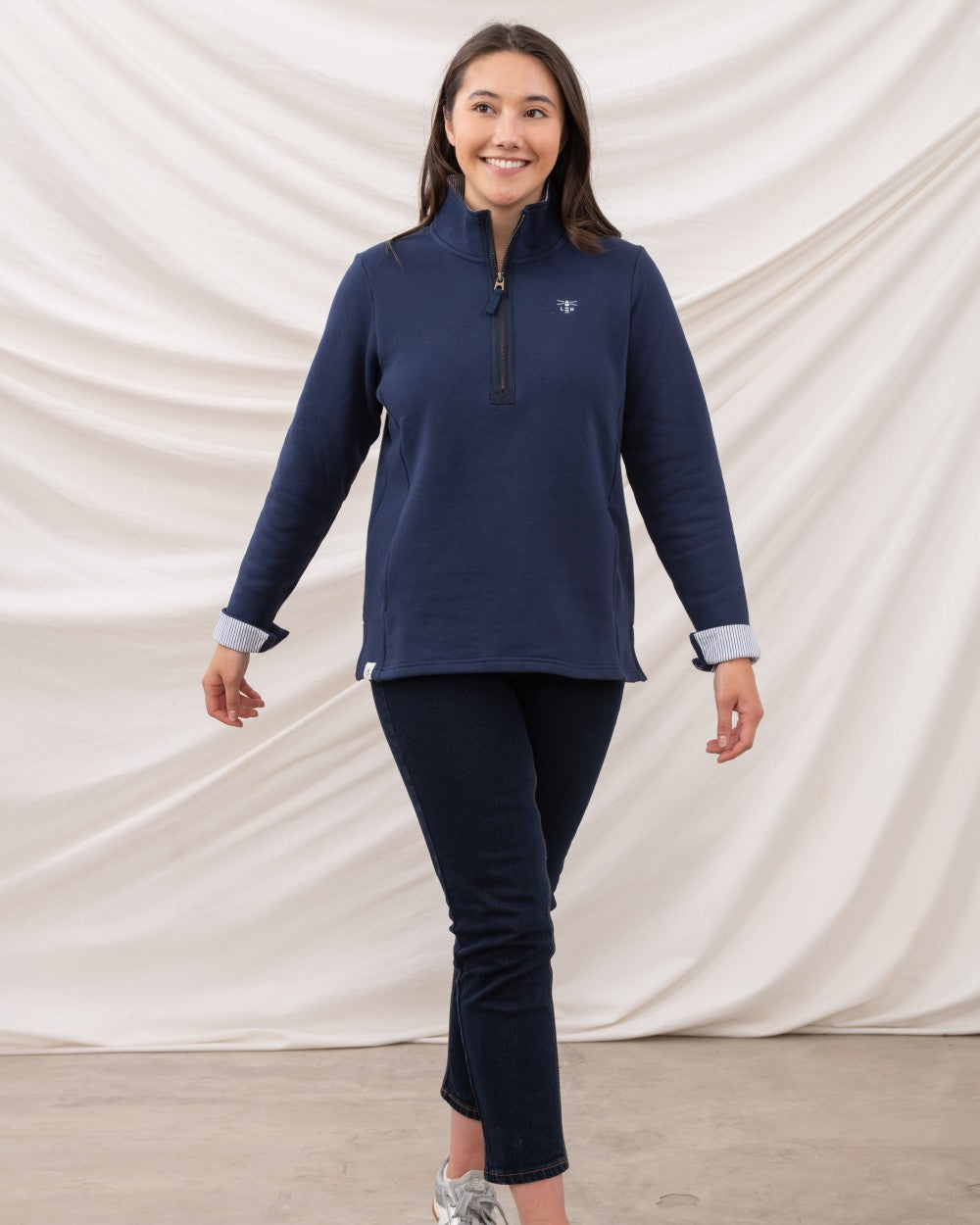 Navy coloured Lighthouse Shore Jersey Top on curtain background