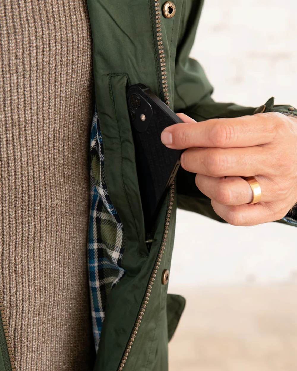 Duffel coloured Lighthouse Long Waterproof Coat on wall background