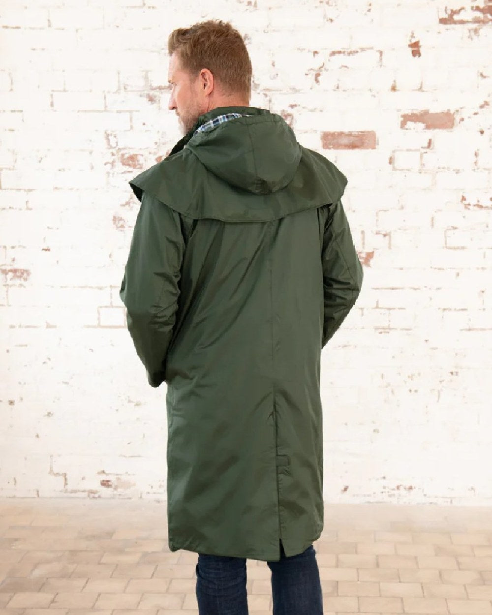 Duffel coloured Lighthouse Long Waterproof Coat on wall background