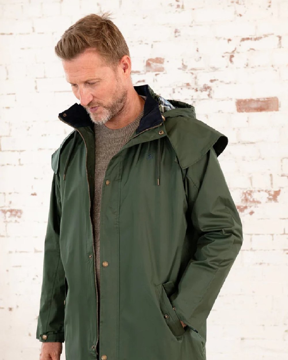 Duffel coloured Lighthouse Long Waterproof Coat on wall background