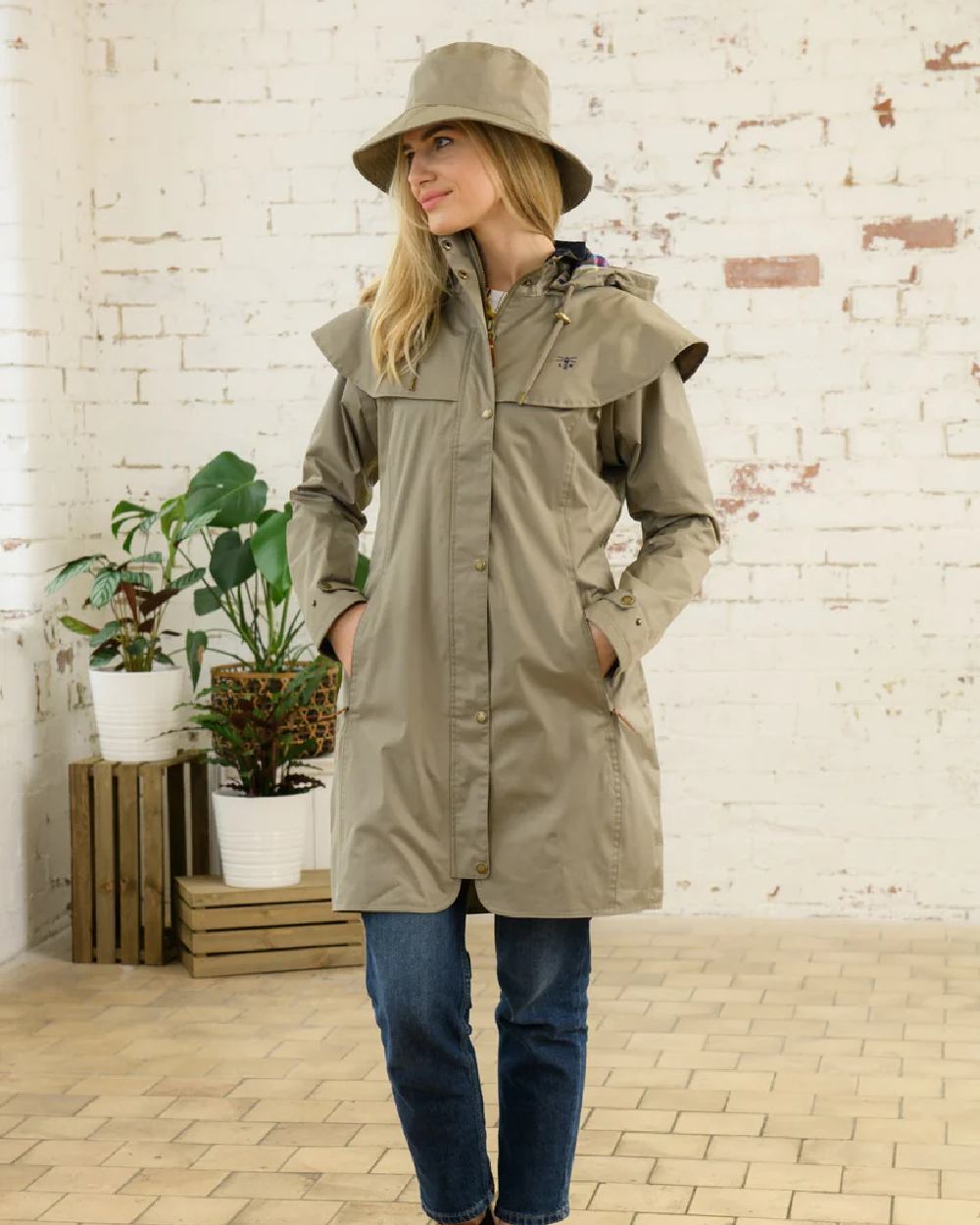 Fawn coloured Lighthouse Storm Waterproof Hat on wall background
