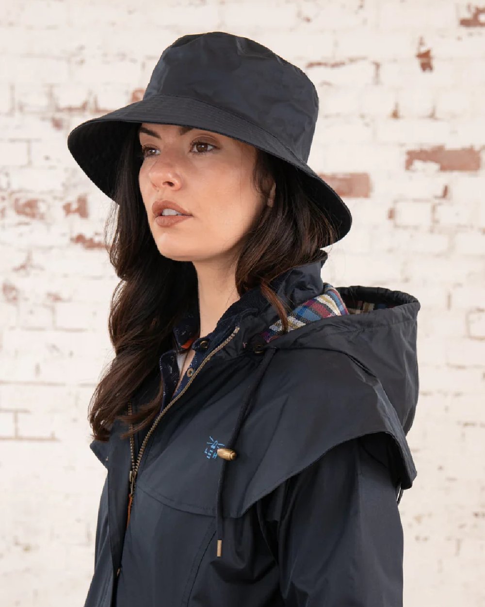 Nightshade coloured Lighthouse Storm Waterproof Hat on wall background