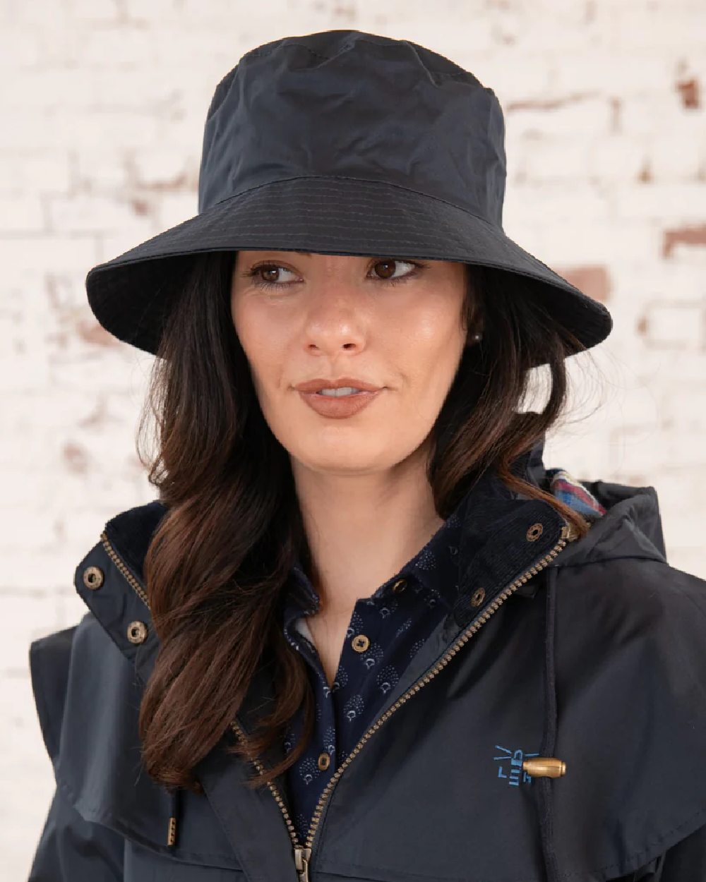 Nightshade coloured Lighthouse Storm Waterproof Hat on wall background