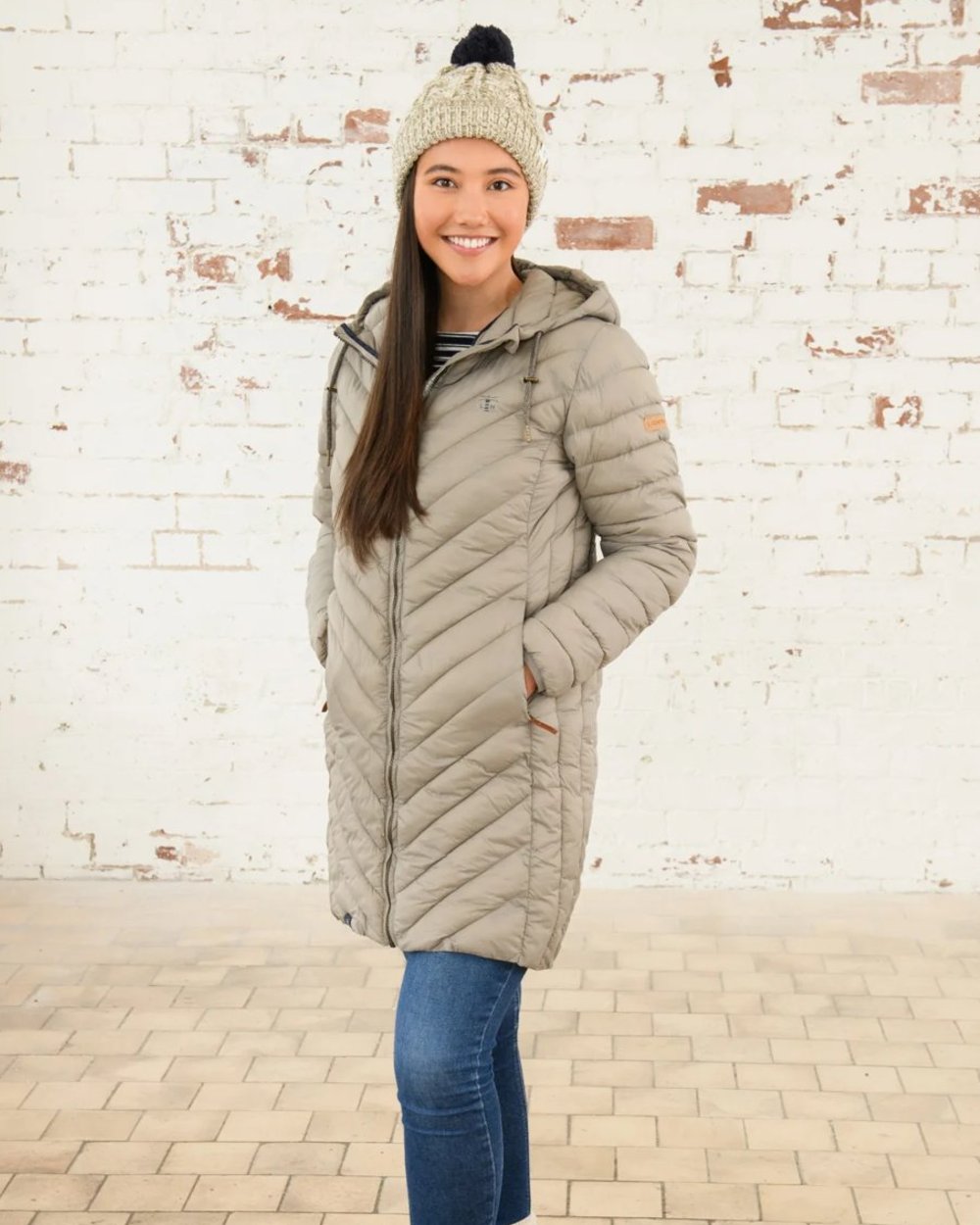 Mocha coloured Lighthouse Laurel Ladies Coat on wall background