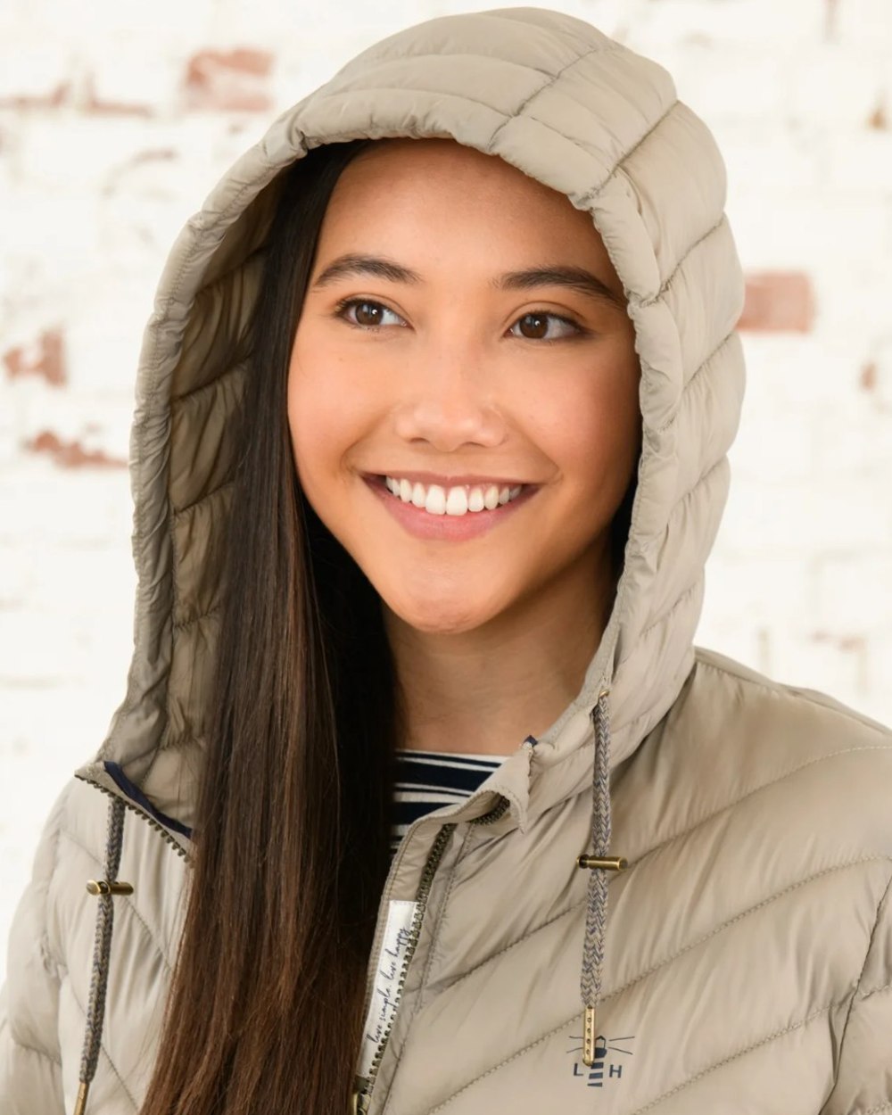 Mocha coloured Lighthouse Laurel Ladies Coat on wall background
