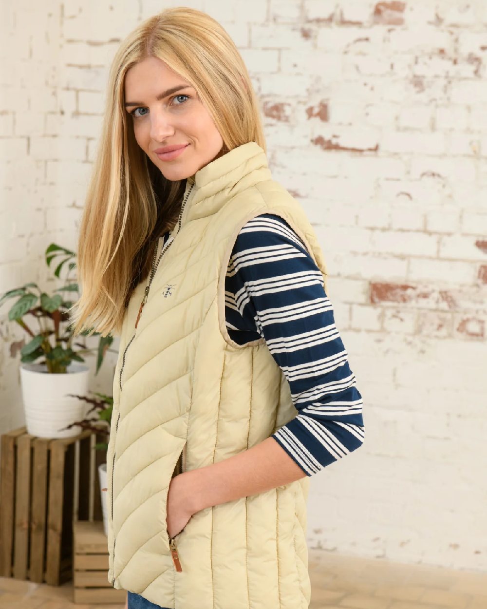 Almond coloured Lighthouse Laurel Ladies Gilet on wall background