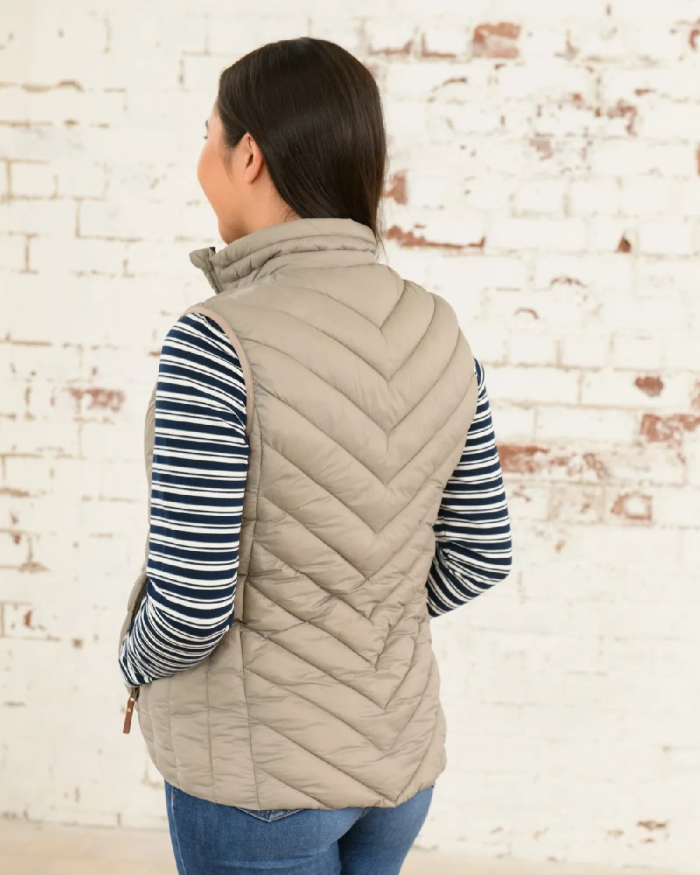 Mocha coloured Lighthouse Laurel Ladies Gilet on wall background