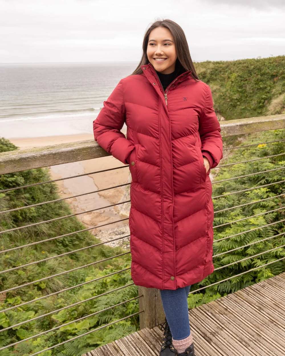 Maroon coloured Lighthouse Savannah Coat on sea background