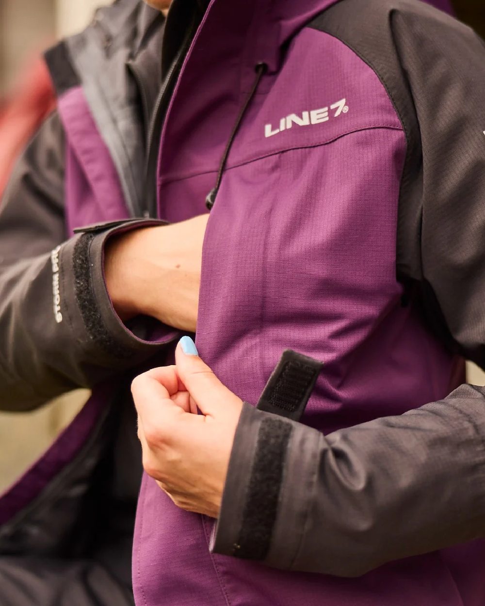 Blackberry Black Colour Line 7 Womens Territory Storm Pro20 Waterproof Jacket on blurry background