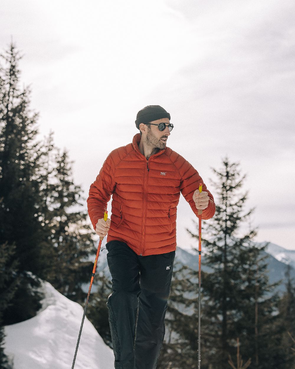 Burnt Orange Coloured Mac In A Sac Mens Synergy Jacket on mountain background