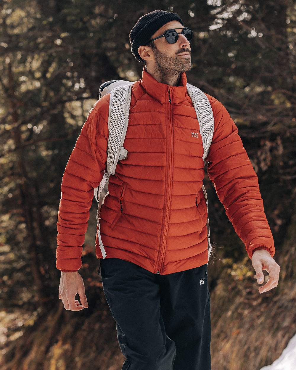 Burnt Orange Coloured Mac In A Sac Mens Synergy Jacket on blurry background