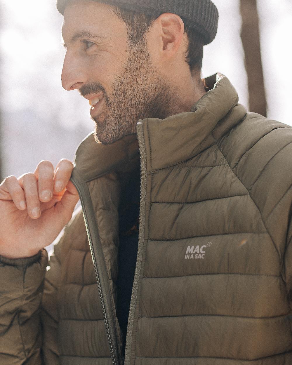 Khaki Coloured Mac In A Sac Mens Synergy Jacket on blurry background