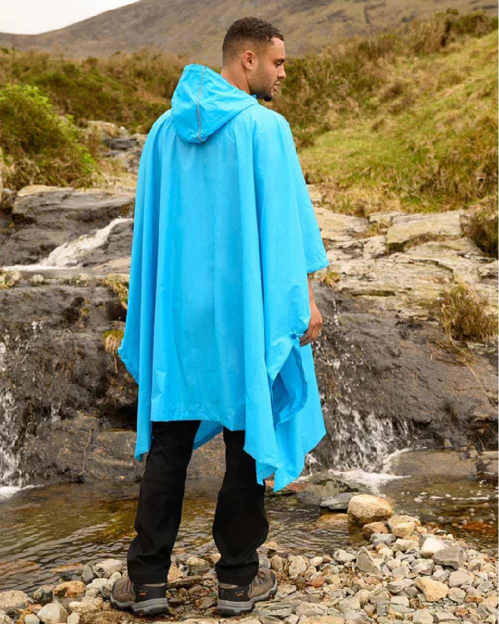 Neon Blue Coloured Mac In A Sac Origin Waterproof Poncho Neon on mountain background