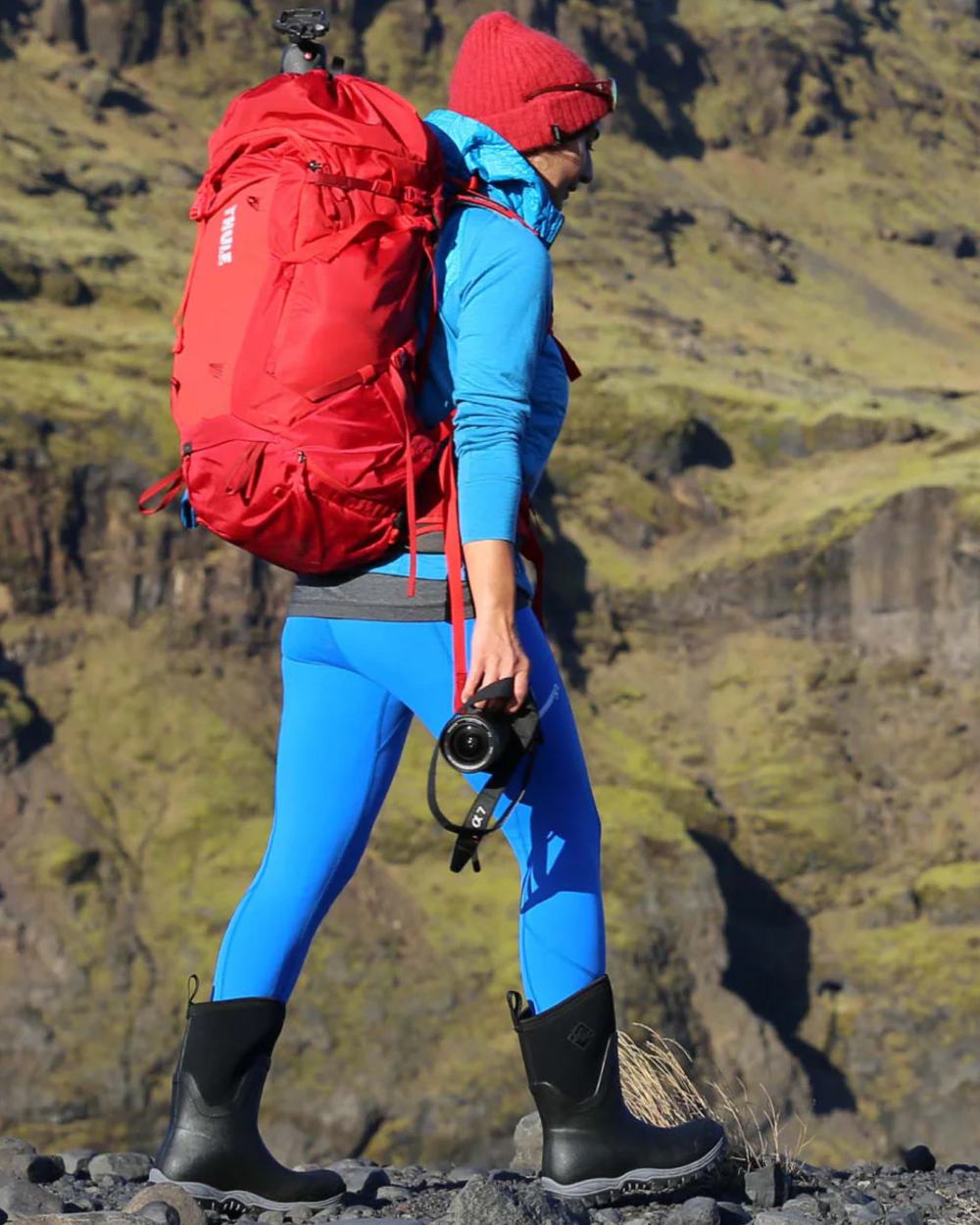 Black Coloured Muck Boots Womens Arctic Sport II Mid Wellingtons On A Mountain Background