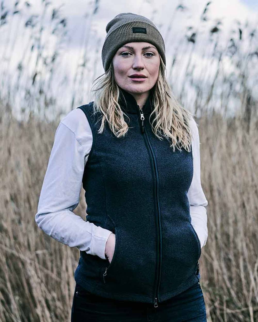 Navy Coloured Musto Ladies Fenland Polartec Vest on outdoor background