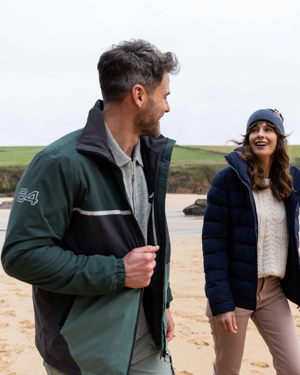 Black Darkest Spruce Coloured Musto Mens 64 Regatta Jacket on beach background