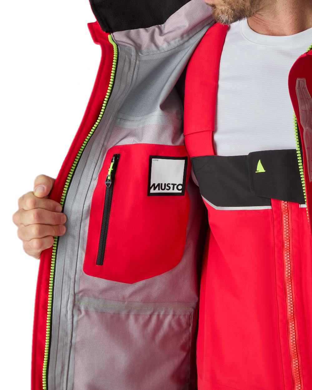 True Red coloured Musto Mens BR3 Pertex Offshore Jacket on white background