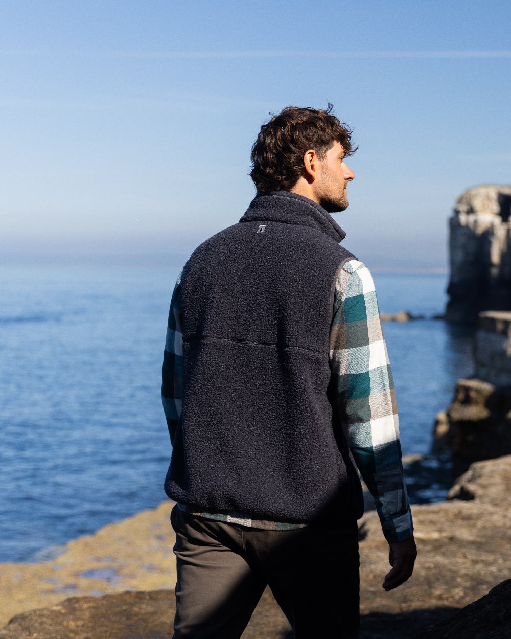 Carbon Coloured Musto Mens Cover Deep Pile Fleece Vest on sea background