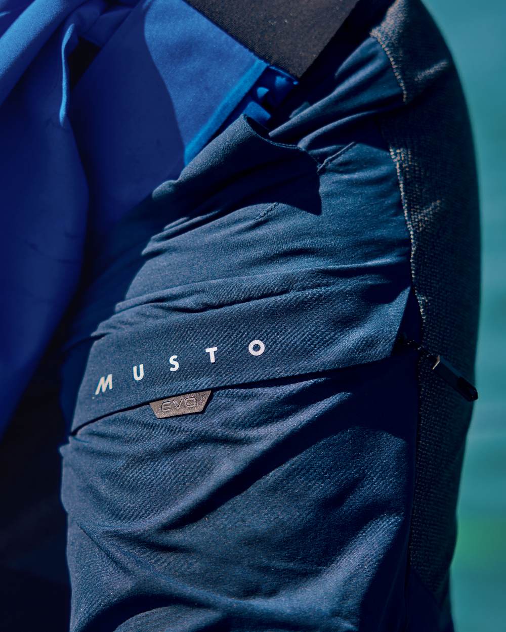 True Navy Coloured Musto Mens Evo Performance Stretch Shorts on outdoor background