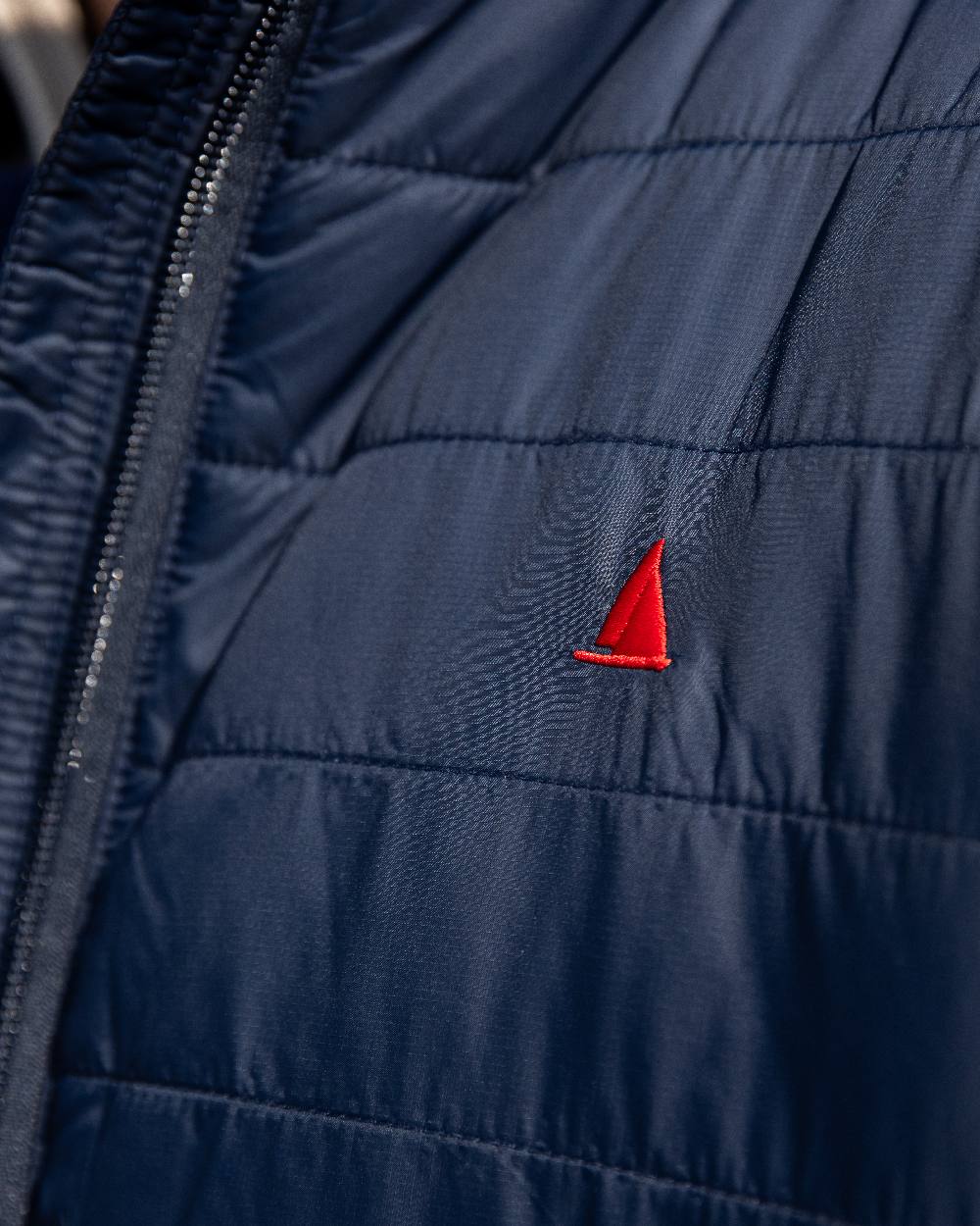 Navy Coloured Musto Mens Original Lite Puffer Jacket on outdoor background