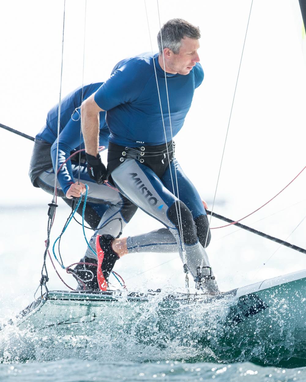 Light Grey Sky Diver coloured Musto Sunblock Dynamic Long John on ocean background
