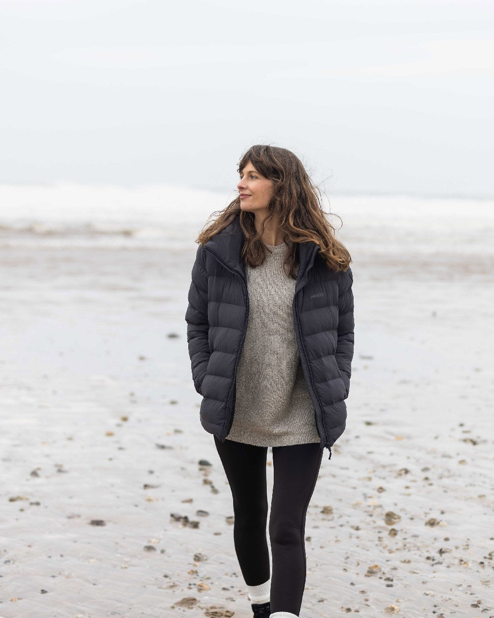 Carbon Coloured Musto Womens Active Puffer Jacket on beach background