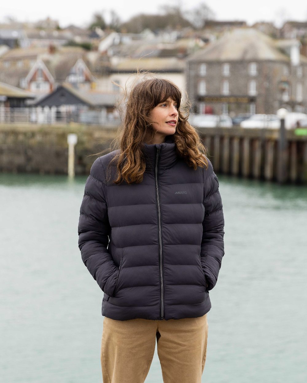 Carbon Coloured Musto Womens Active Puffer Jacket on lake background