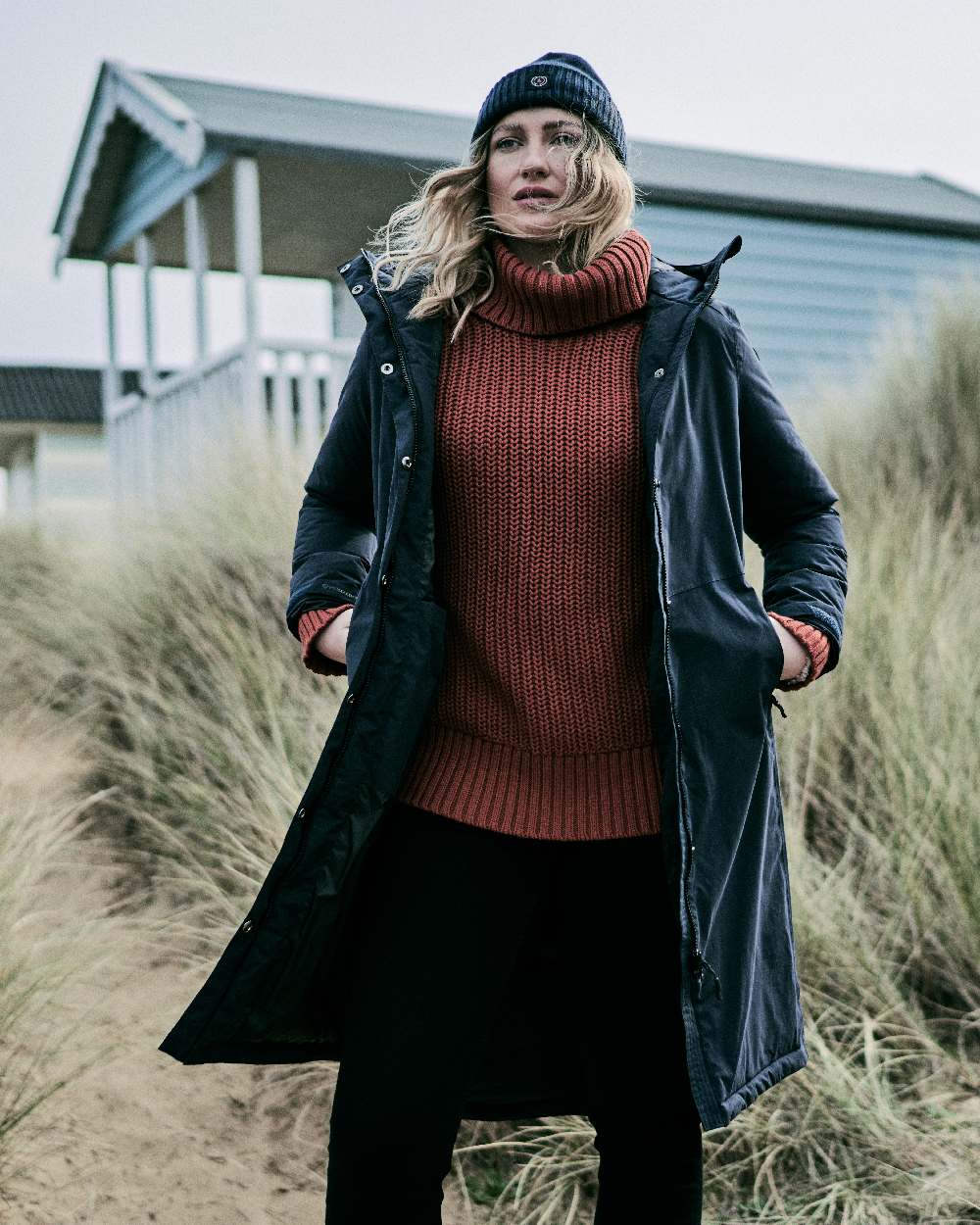 Black coloured Musto Womens Corsica Primaloft Longline Parka on grass background