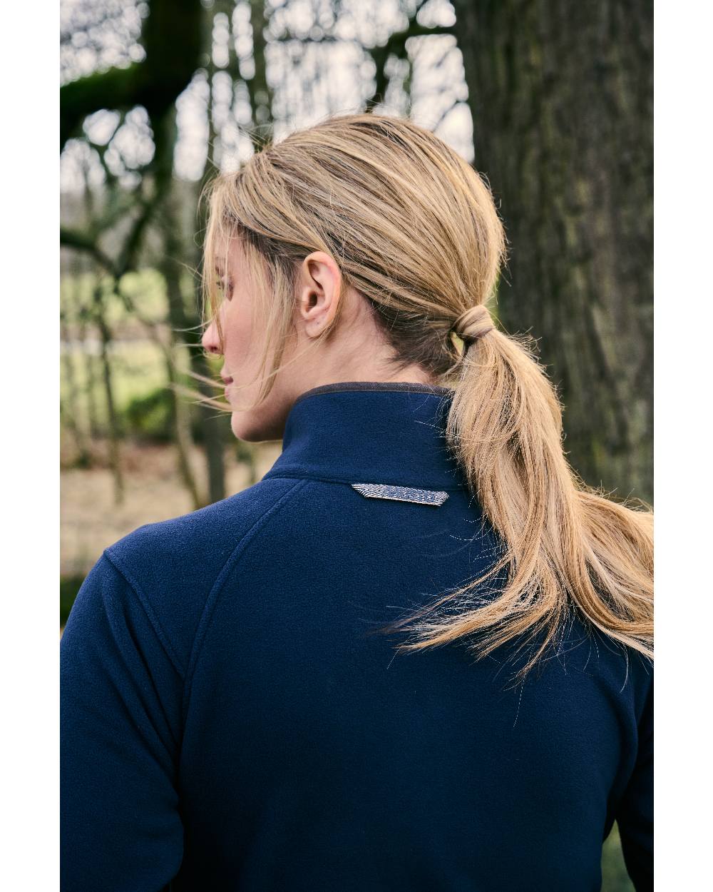 Navy Coloured Musto Womens Fenland 200 Polartec Jacket On Sea Background