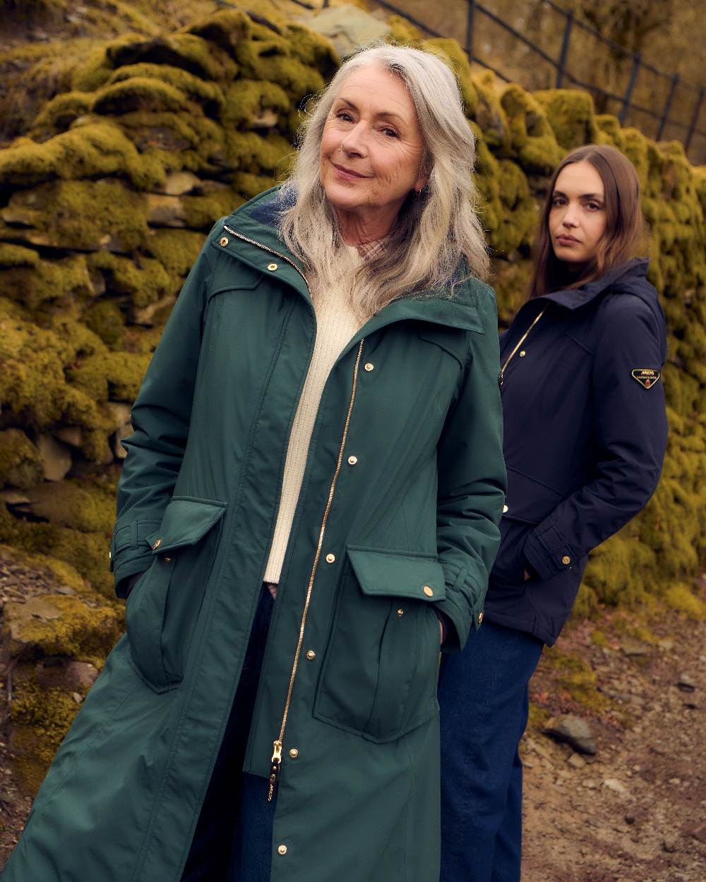 Darkest Spruce Coloured Musto Womens Odyssey Waterproof Coat on outdoor background