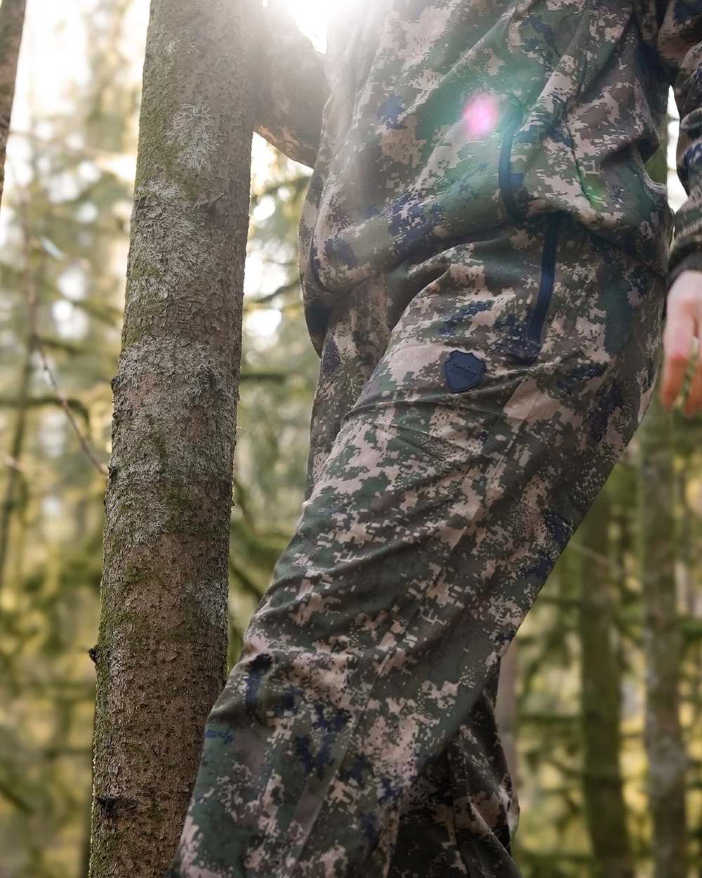 Camo coloured Northern Hunting Kjell Balk Tanatex Hunting Trousers on forest background