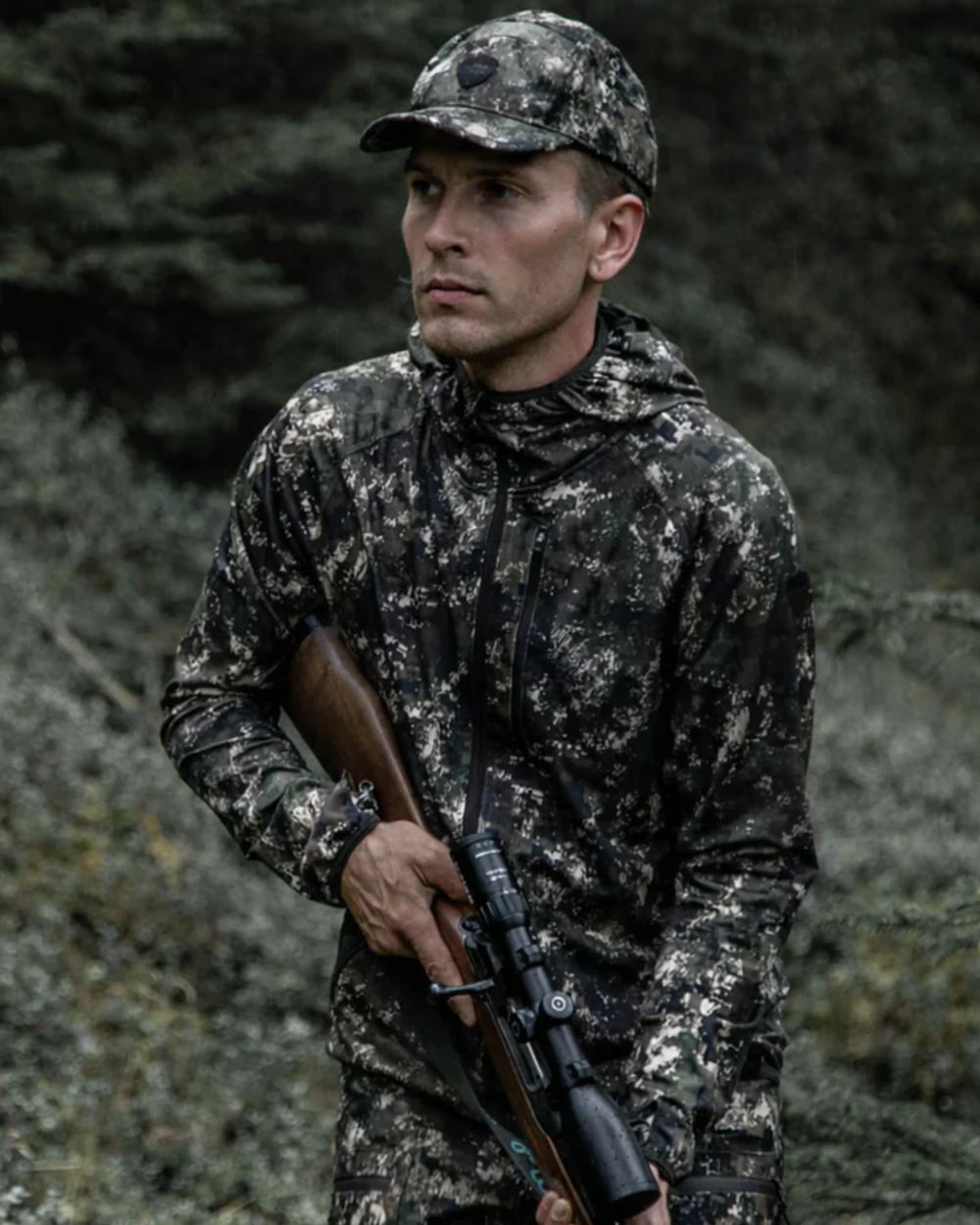 Camo coloured Northern Hunting Mens Alvar Lightweight Hunting Jacket on forest background