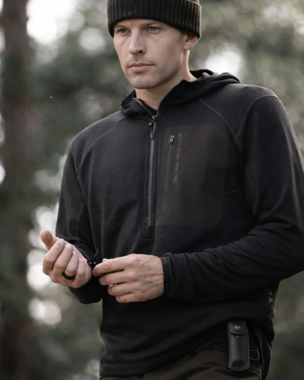 Dark Green coloured Northern Hunting Mens Rolf Half Zip Sweatshirt on forest background