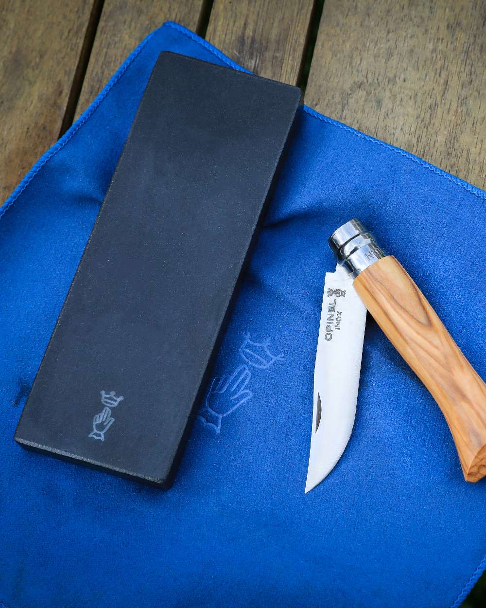 14cm Opinel Sharpening Stone on wood background