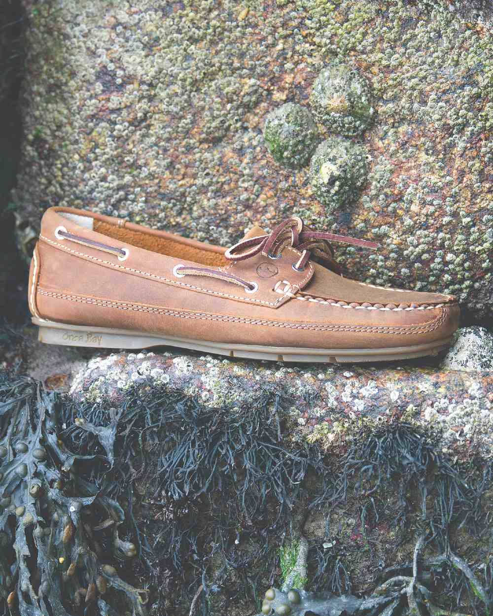 Sand Coloured Orca Bay Bahamas Womens Deck Shoes On A Stone Background