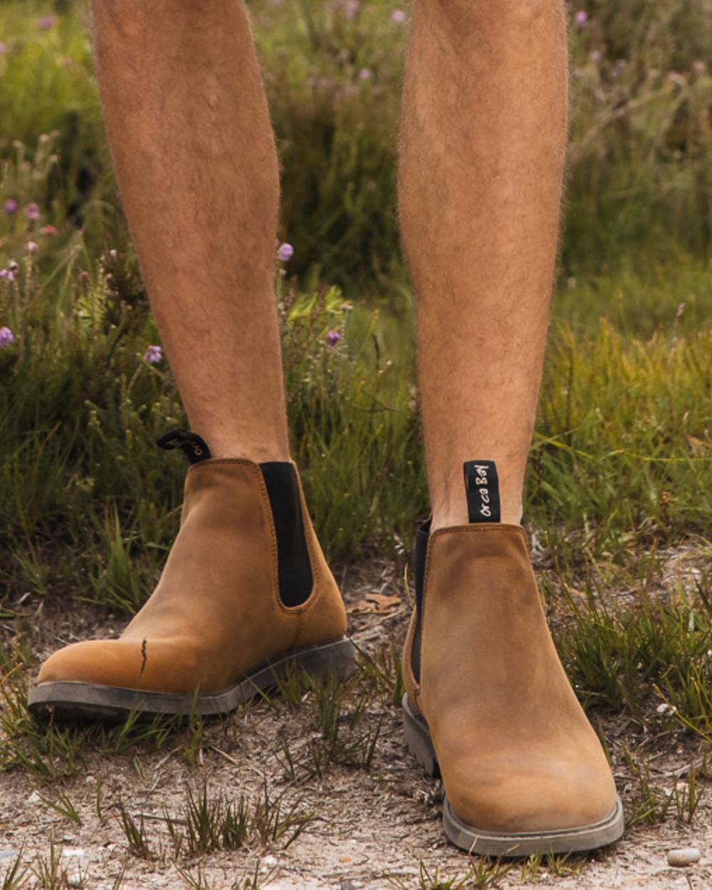 Sand coloured Orca Bay Mens Henley Shoes on grass background