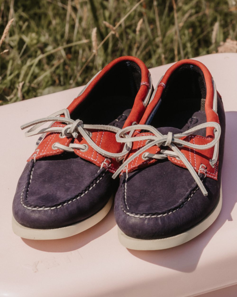 Indigo Berry Coloured Orca Bay Mens Sandusky Deck Shoes On A Grassy Background