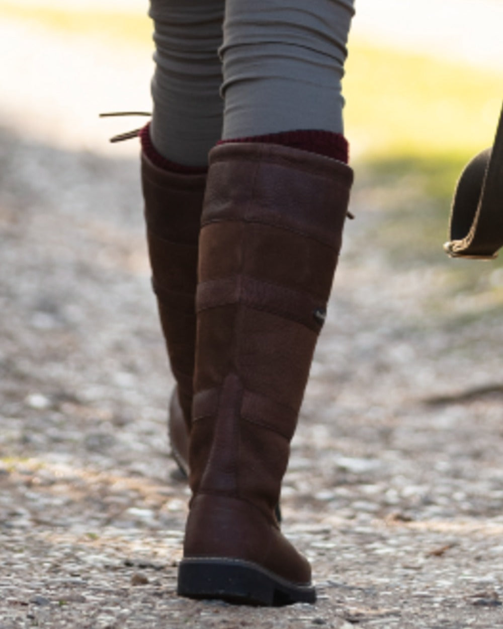 Brown coloured Orca Bay Orkney S-Fit Country Boots on outdoor background