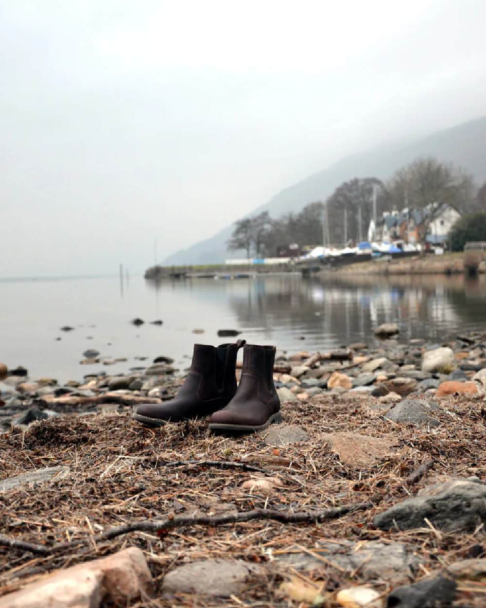Dark Brown Coloured Orca Bay Womens Cotswold Ankle Boots on lake background