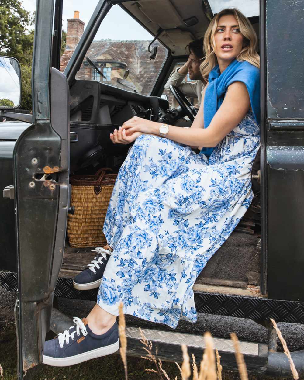 Indigo coloured Orca Bay Womens Mayfair Trainers on car background