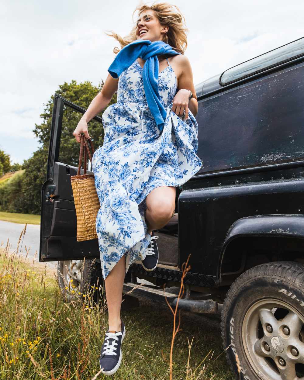 Indigo coloured Orca Bay Womens Mayfair Trainers on grassy background