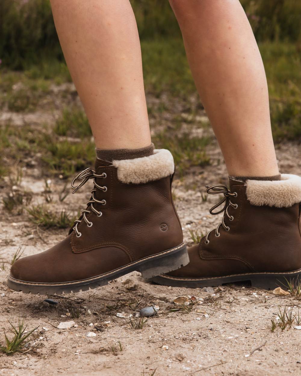 Brown coloured Orca Bay Womens Real Sheepskin Lining Pennine Boots on outdoor background