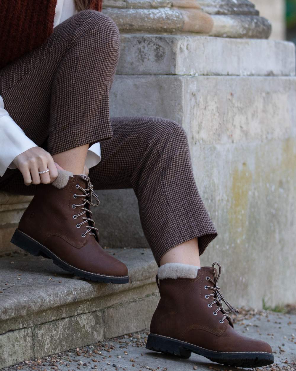 Brown coloured Orca Bay Womens Real Sheepskin Lining Pennine Boots on stairs background