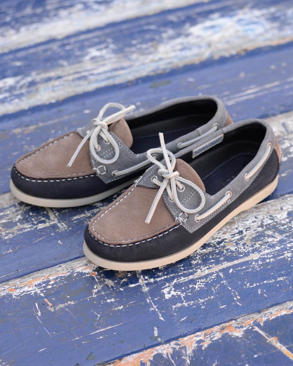 Taupe Indigo Grey coloured Orca Bay Womens Sandusky Deck Shoes on outdoor background