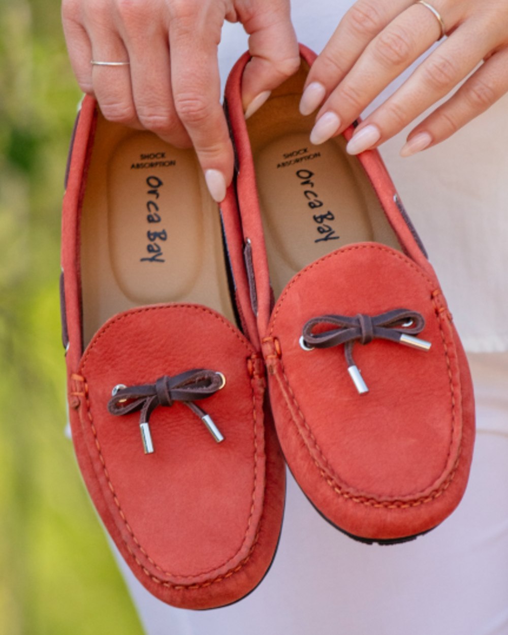 Red coloured Orca Bay Womens Vienna Loafers on outdoor background
