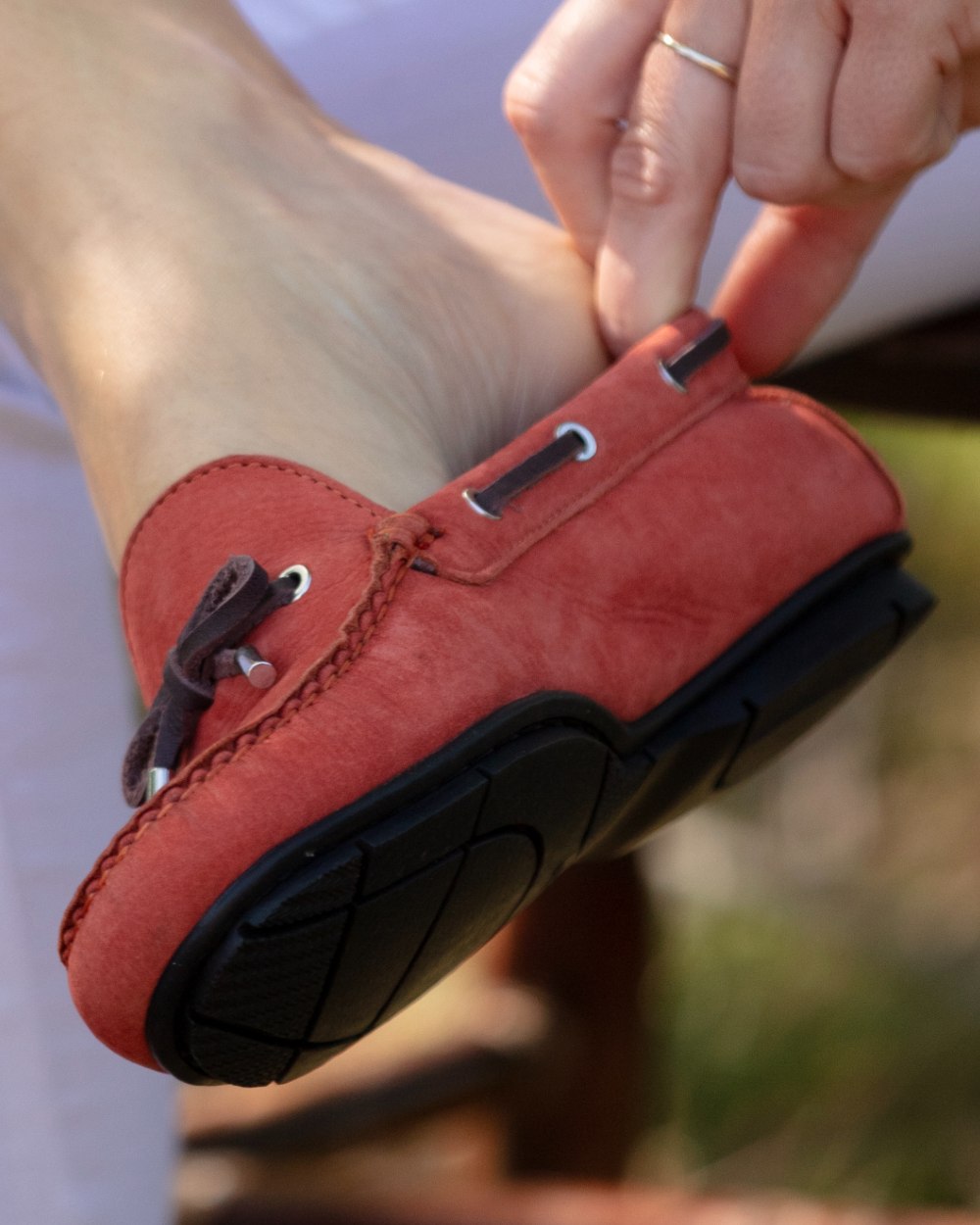 Red coloured Orca Bay Womens Vienna Loafers on outdoor background