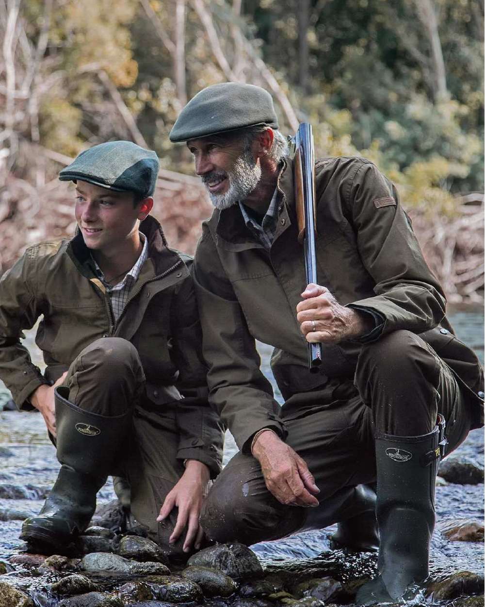 Khaki coloured Percussion Imperlight Reinforced Trousers on riverside background