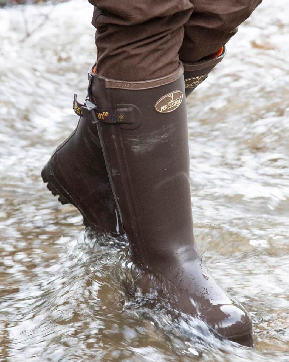 Brown coloured Percussion Rambouillet Full Zip Wellington Boots on water background