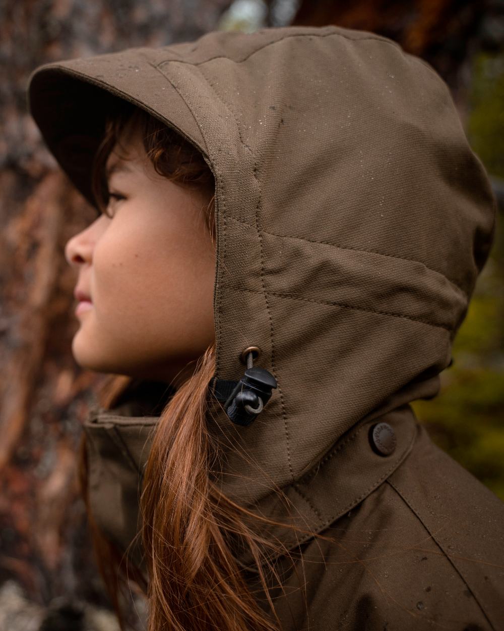Hunting Olive coloured Pinewood Childrens Finnveden Hybrid Jacket on forest background